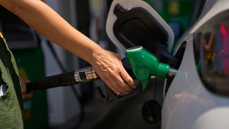 Person filling gas tank