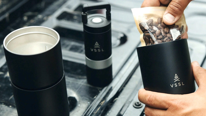 Person getting beans for VSSL Pour Over set