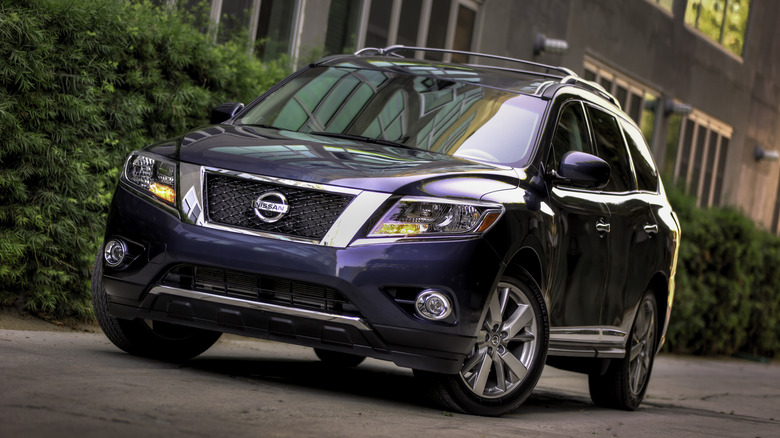 A purple 2013 Nissan Pathfinder parked