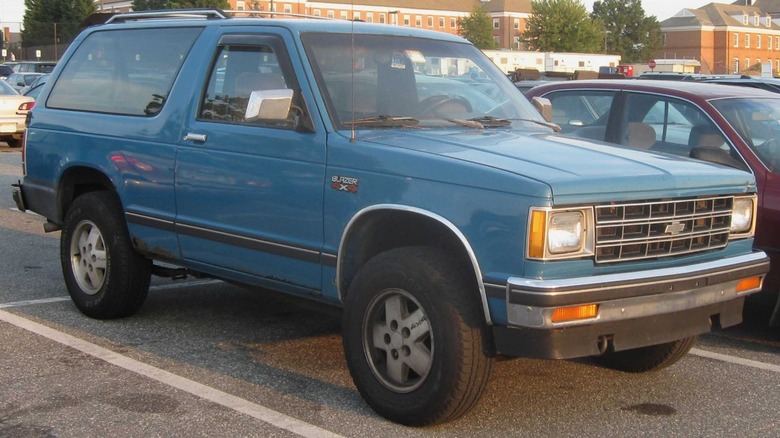 a blue Chevrolet S-10 Blazer 2-door in a parking lot