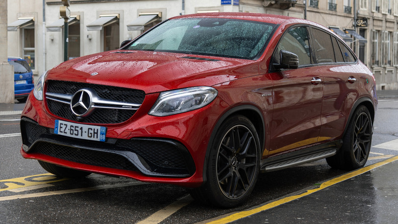 A red 2020 Mercedes GLE Coupe parked on an urban French setting.