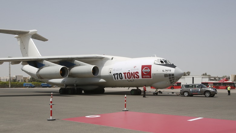 Nissan Patrol SUV is towing a massive cargo aircraft