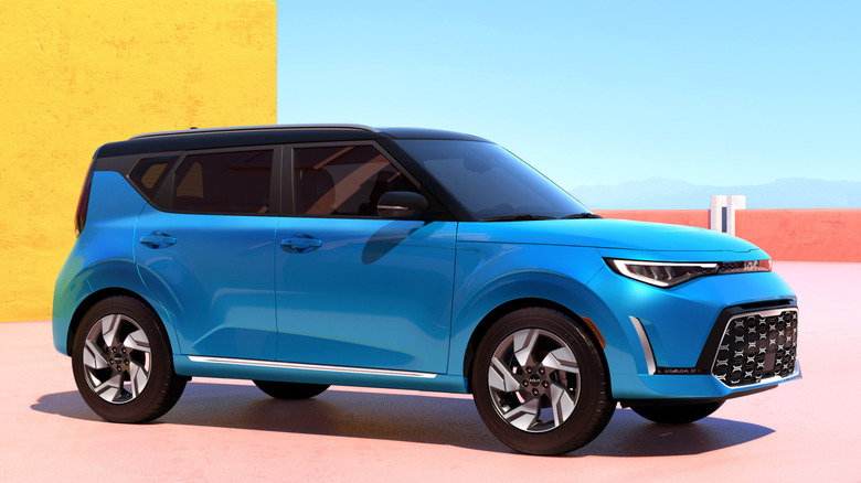 Front 3/4 view of Kia Soul on terrace with mountains in background