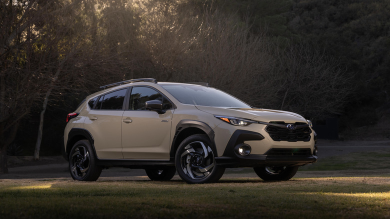 A beige Subaru Crosstrek parked