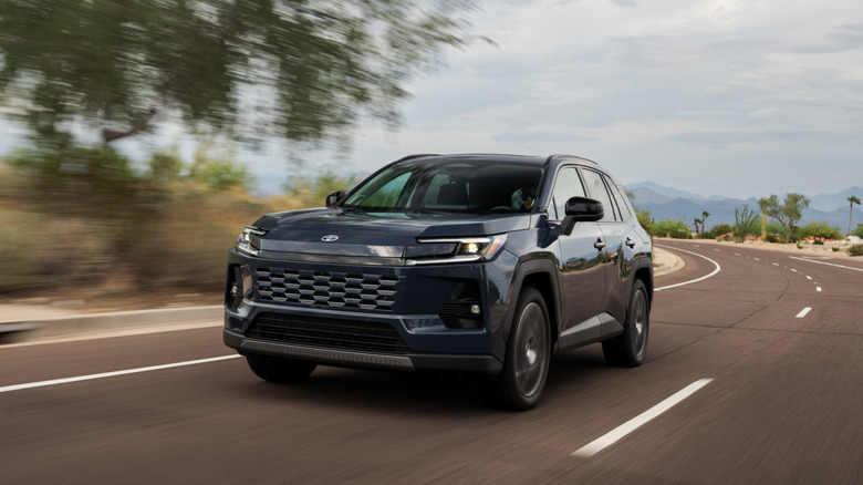A black Toyota RAV4 driving