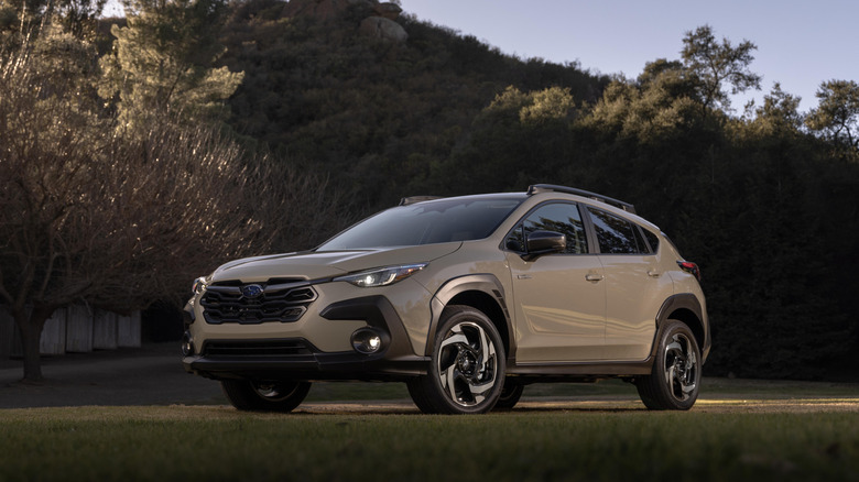 A beige Subaru Crosstrek parked