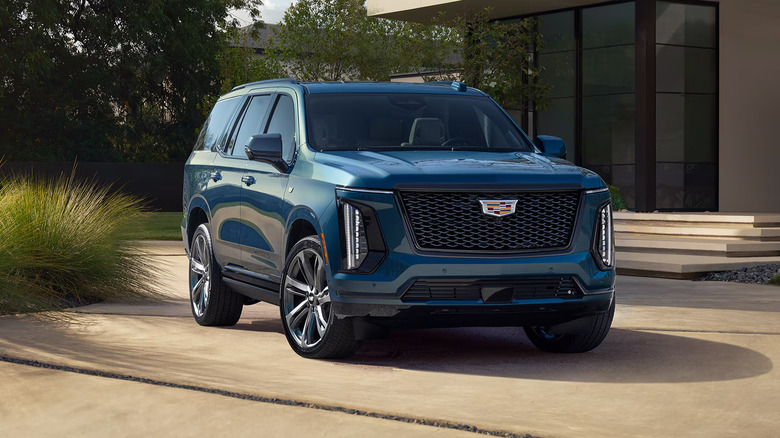 A blue 2025 Cadillac Escalade parked