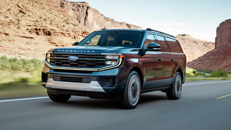A black 2025 Ford Expedition driving