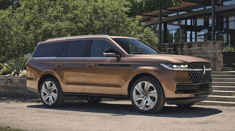 A bronze 2025 Lincoln Navigator parked