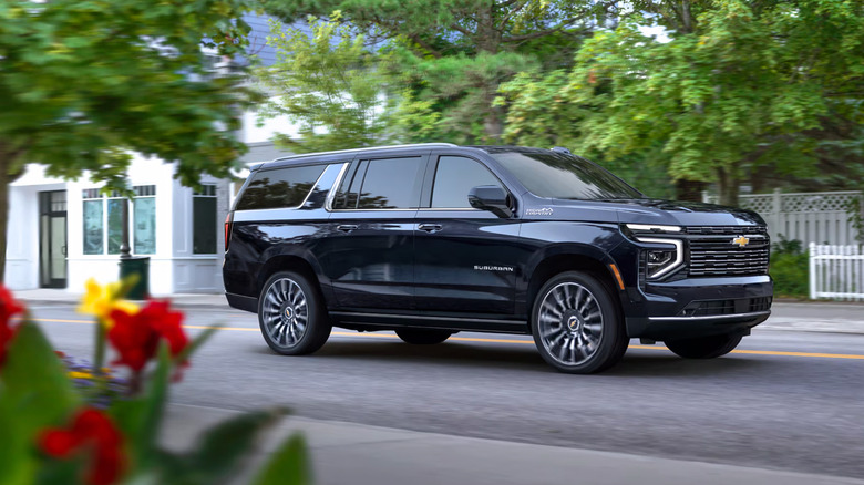 A dark blue 2025 Chevrolet Suburban driving