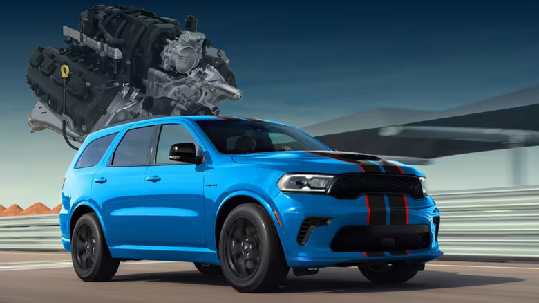 A blue Dodge Durango SRT Hellcat with red and black racing stripes and an engine in the background.