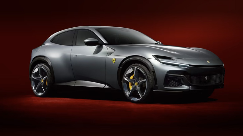 A Ferrari Purosangue in silver against a dark red background.