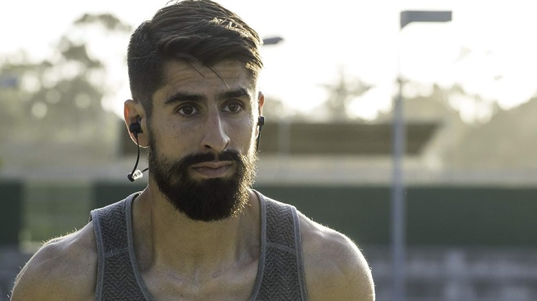 A jogger wearing a pair of JayBird earbuds.