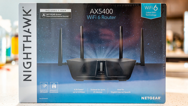 Netgear Nighthawk AX5400 WiFi 6 router package paced on a table