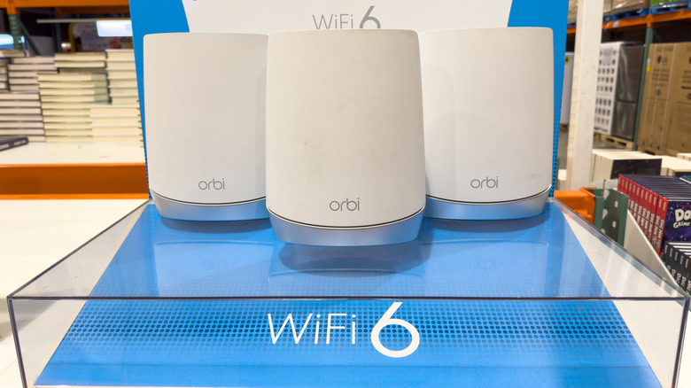 Netgear Orbi wifi mesh system placed on display inside a store