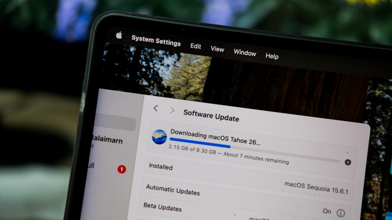 A Mac computer being update to macOS Tahoe