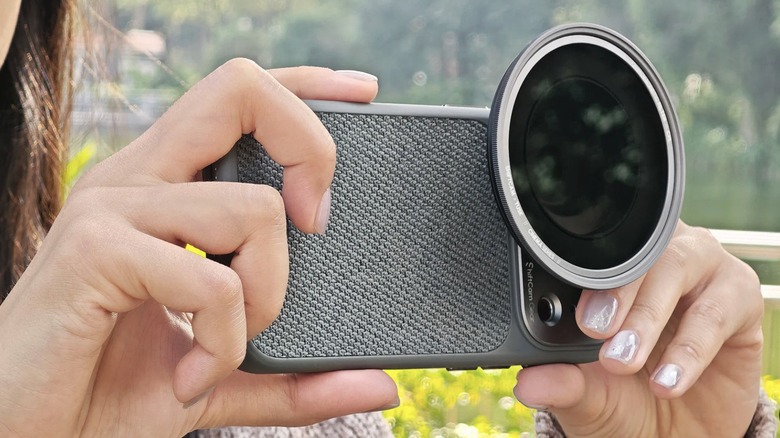 iPhone with big lens attached and filter