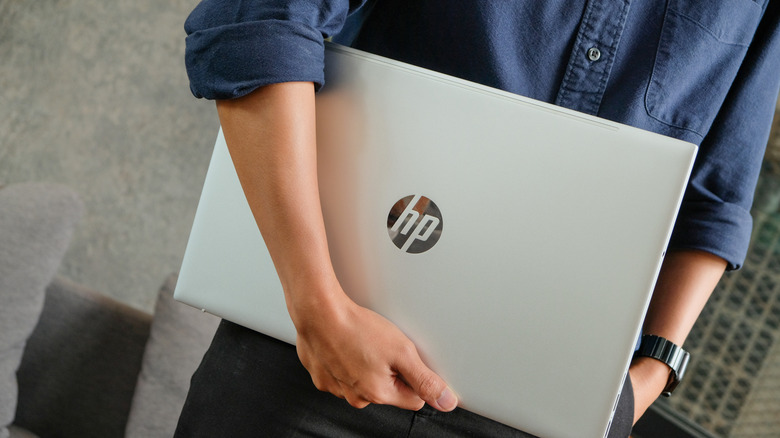 Person holding a HP laptop