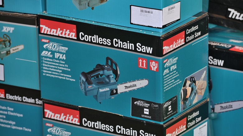 Makita cordless chainsaw boxes piled on top of one another