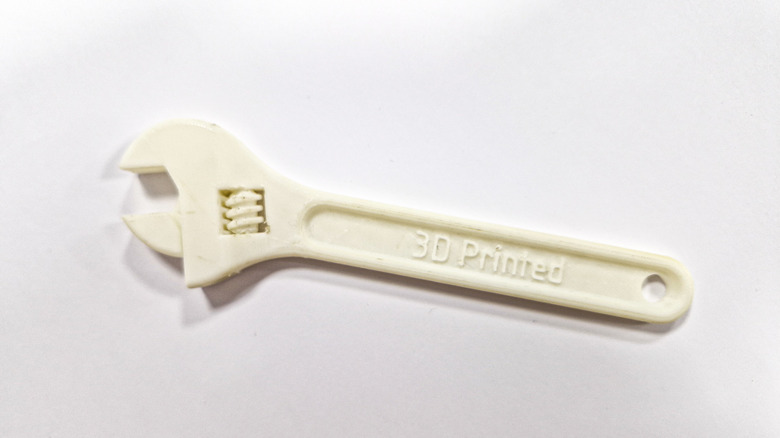 A white 3D printed wrench