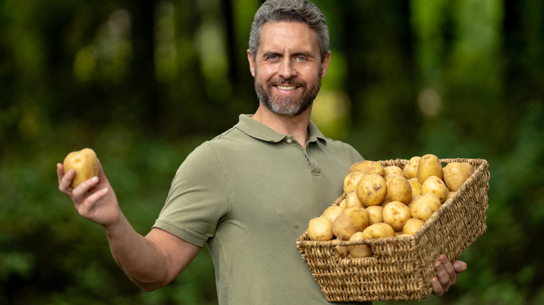 Man very proud of his potatoes
