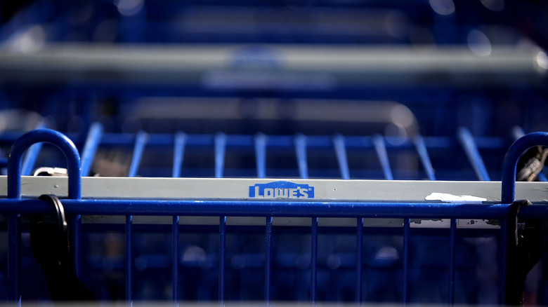 The Lowe's logo displayed on a blue shopping cart