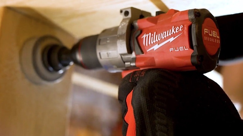 Person using Milwaukee Tools drill