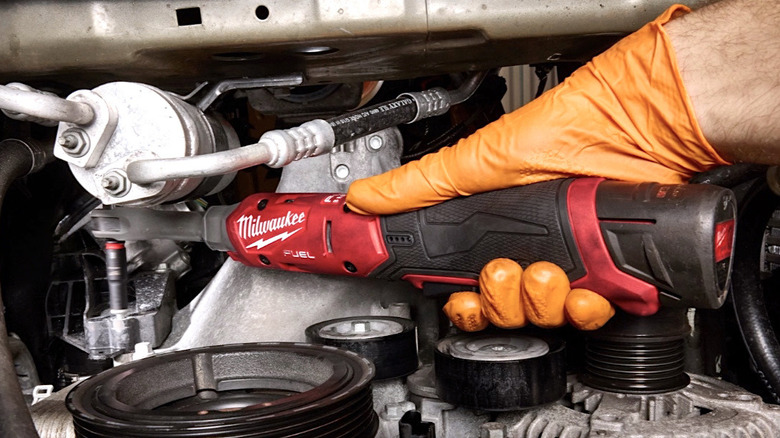 Person using Milwaukee Tools powered ratchet