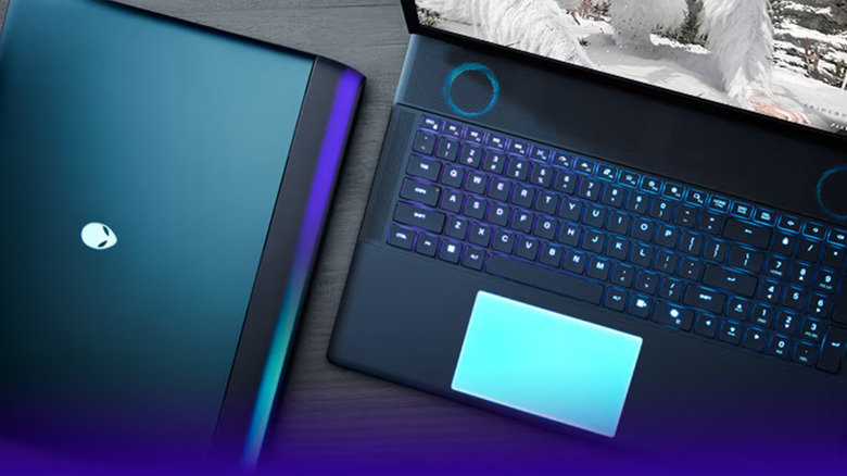 A laptop next to a second laptop on a desk