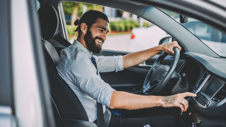 Man using car stereo