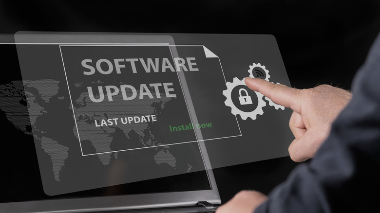 Software update text above a laptop screen