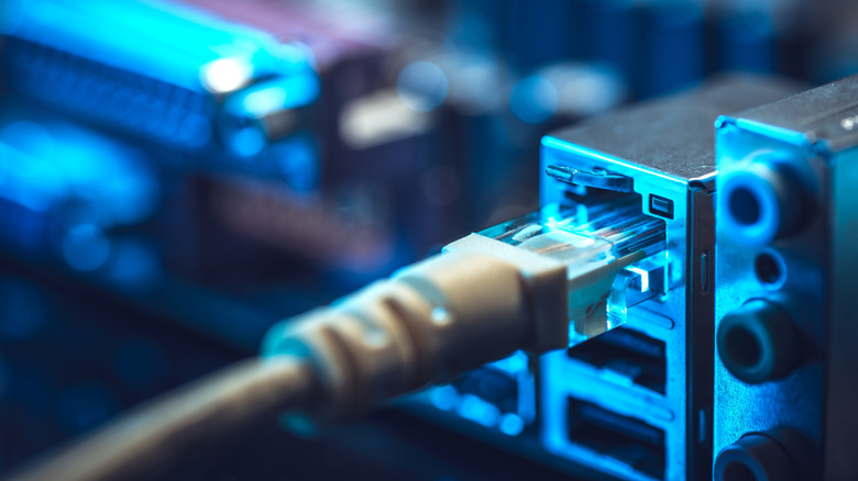 An Ethernet cable plugged into an Ethernet port on motherboard I/O