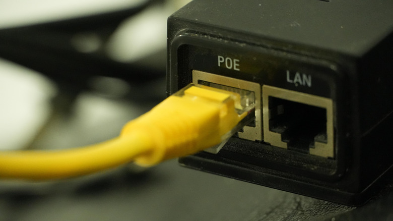 Ethernet cable plugged into a PoE adapter