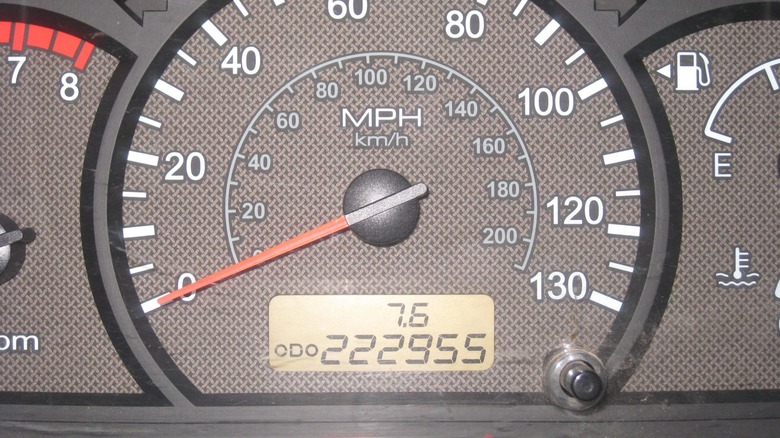 A closeup of a car's odometer showing very high mileage