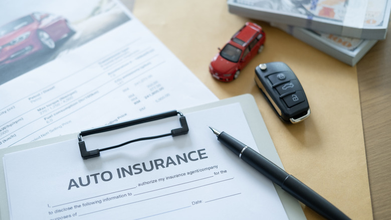 Image of an auto insurance document on a desk.