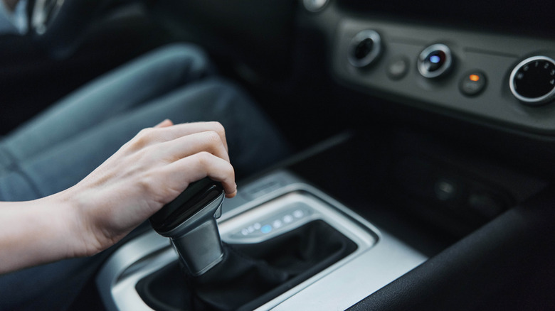 Hand on the gear of an automatic car