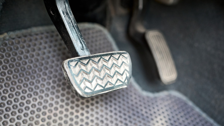 The accelerator and brake pedals in a car