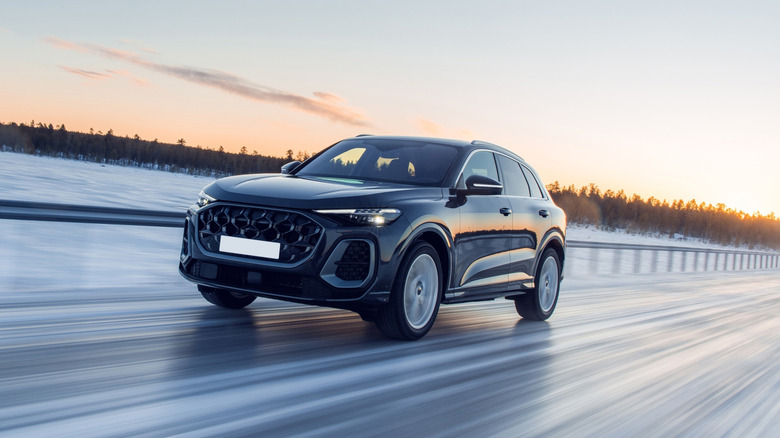 An SUV speeding on an icy highway
