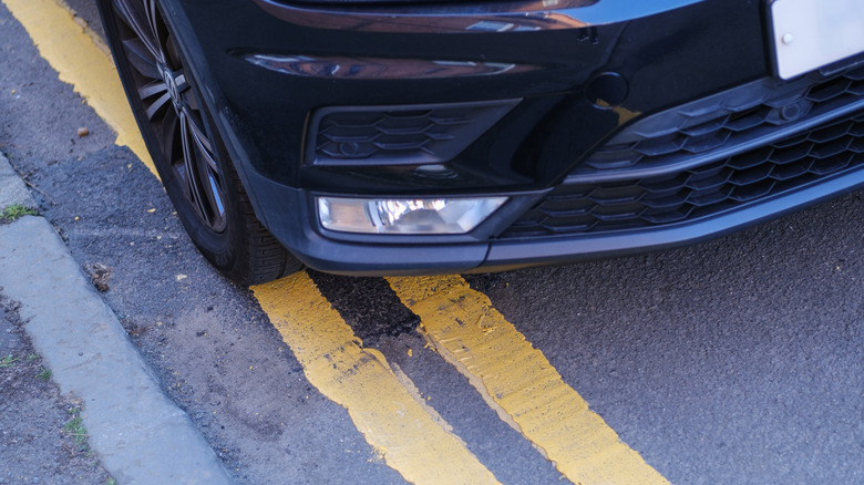 A car crossing illegally over a double yellow line