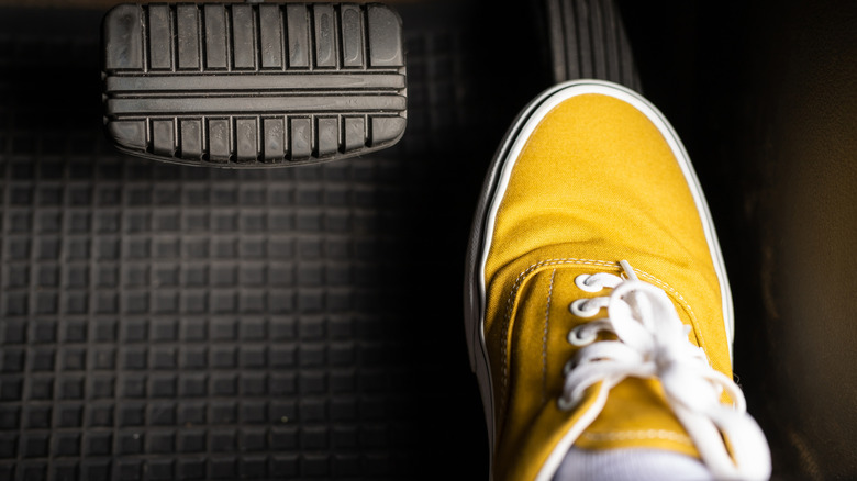 Foot pressing car accelerator to the floor