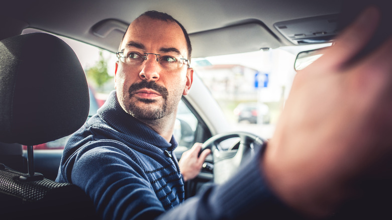 Man reversing car