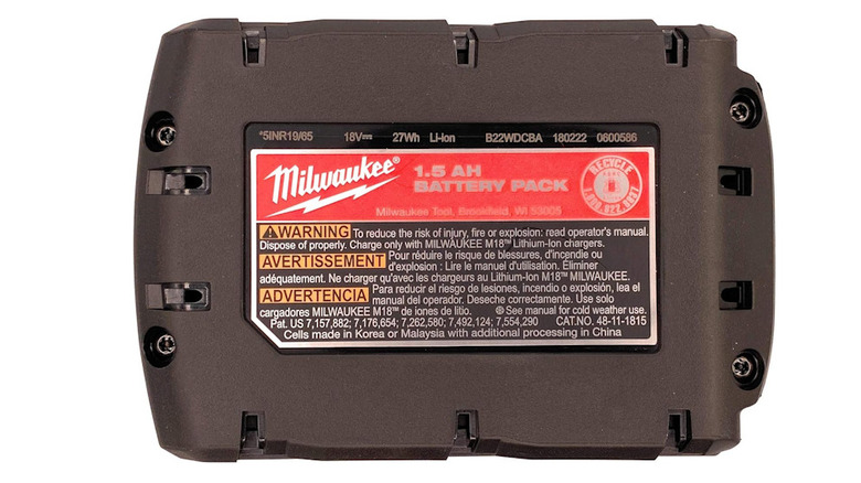 Bottom of a Milwaukee battery with the full description of warnings