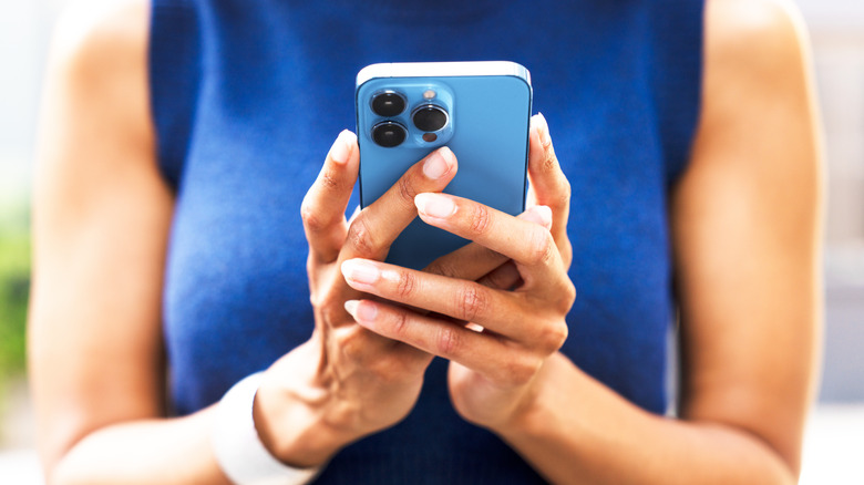 Woman using an iPhone