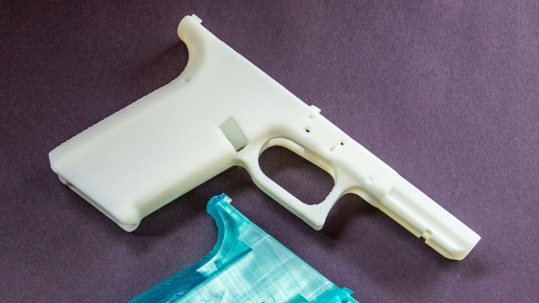 3D printed gun parts lying on a flat surface