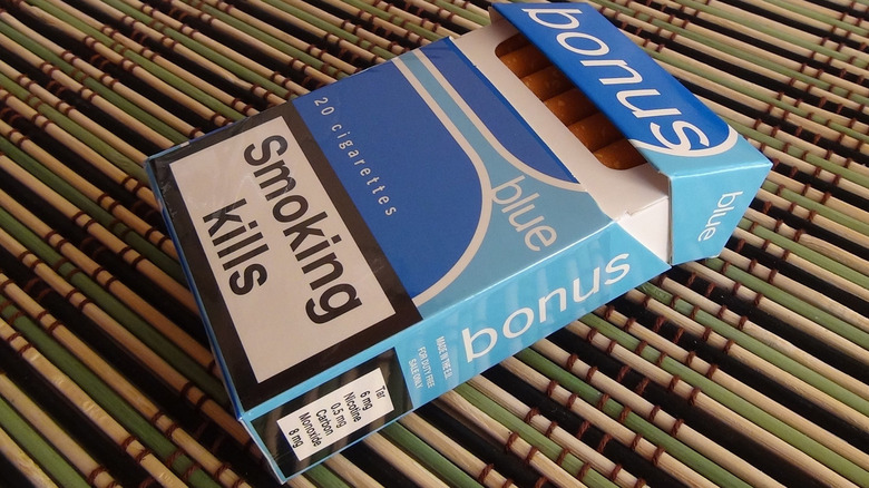 A pack of cigarettes with a large "smoking kills" label on the packaging