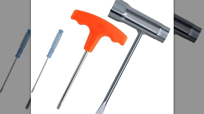 A stock image of chainsaw repair tools.