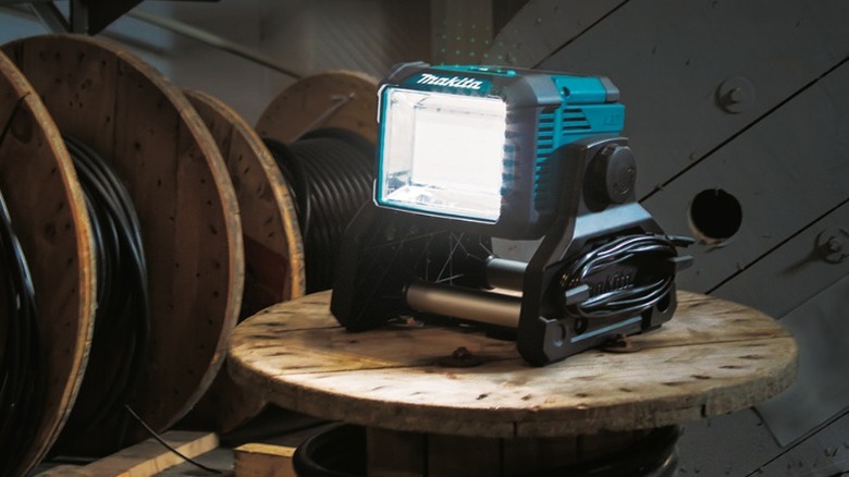 Work light sitting on wooden wheel