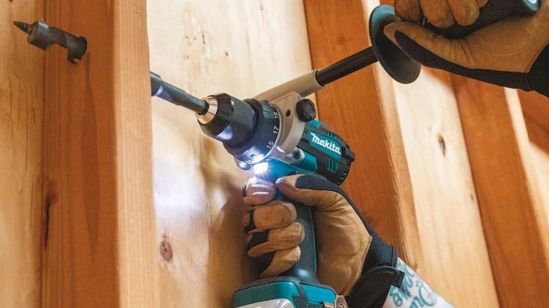 Makita drill drilling through stud