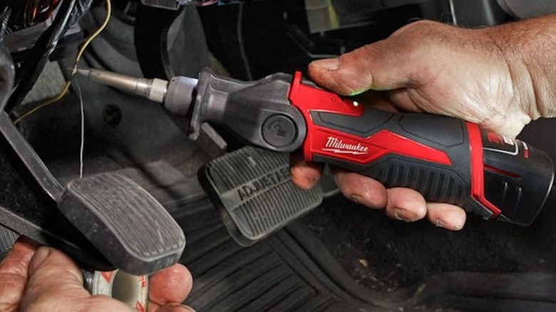 soldering wires in a car with the M12 soldering iron