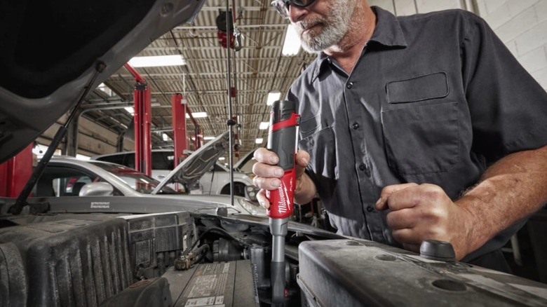 using an M12 ratchet during car repair